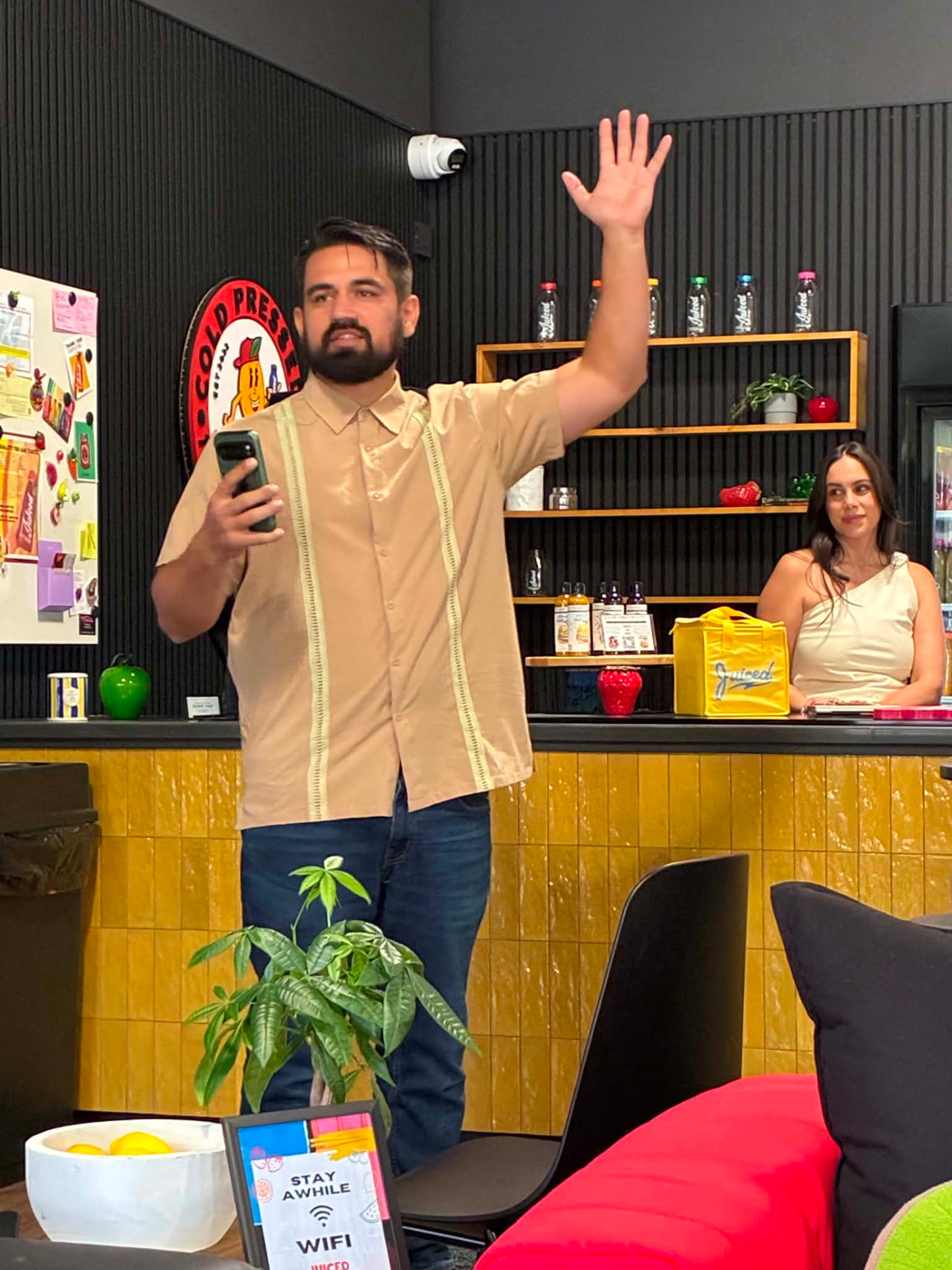 Juan Telles with a local business owner
