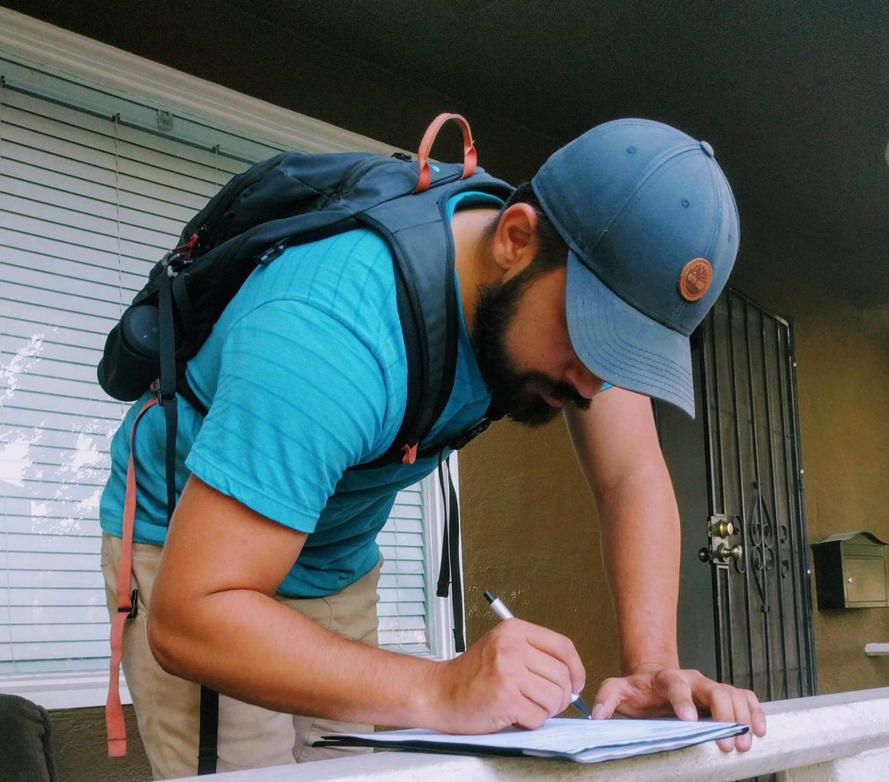Juan Telles canvassing in the neighborhood